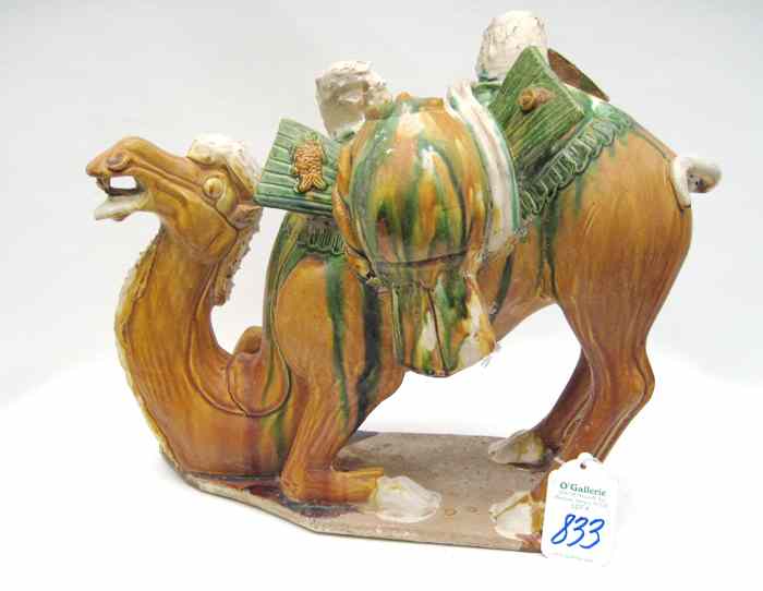 Appraisal: A CHINESE POTTERY BACTRIAN TWO-HUMPED CAMEL having hand painted slips