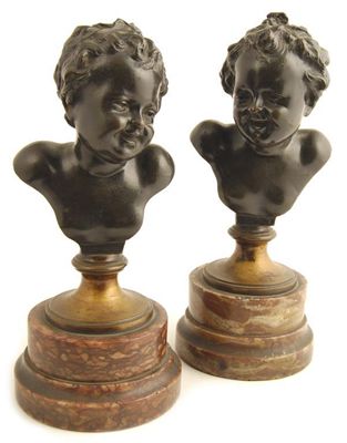 Appraisal: After Clodion A pair of busts of children with tied