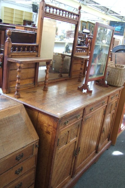 Appraisal: A late th century oak aesthetic movement sideboard the mirrored