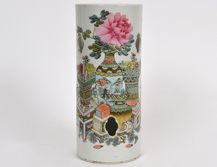 Appraisal: CHINESE FAMILLE ROSE ENAMEL DECORATED VASEThe pierced cylindrical wig stand