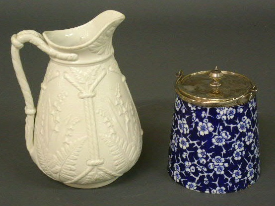 Appraisal: English white porcelain pitcher h and a blue biscuit jar