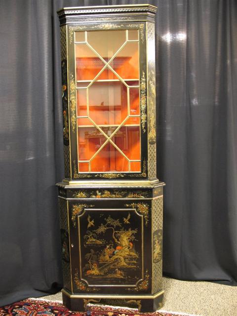 Appraisal: CHINOISERIE BLACK LACQUER CORNER CABINET th century the small case