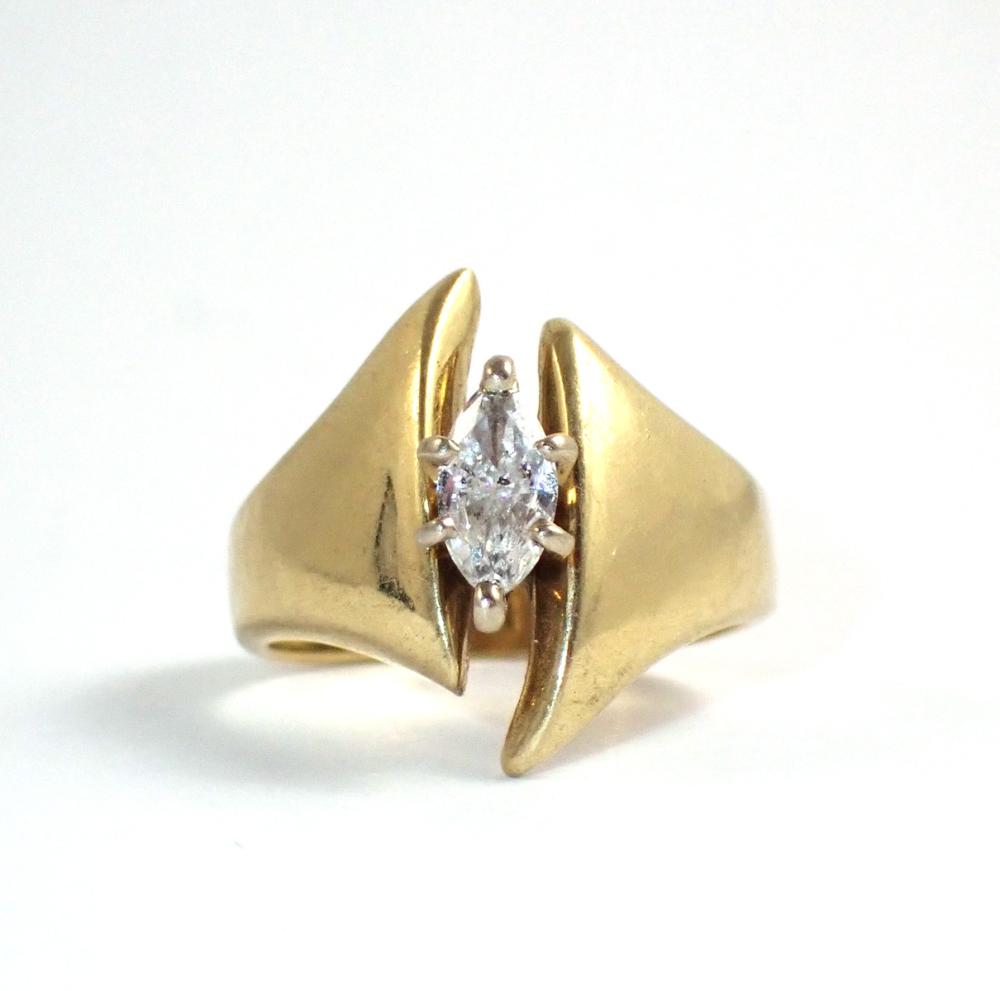 Appraisal: DIAMOND AND FOURTEEN KARAT GOLD SOLITAIRE RING with six gold