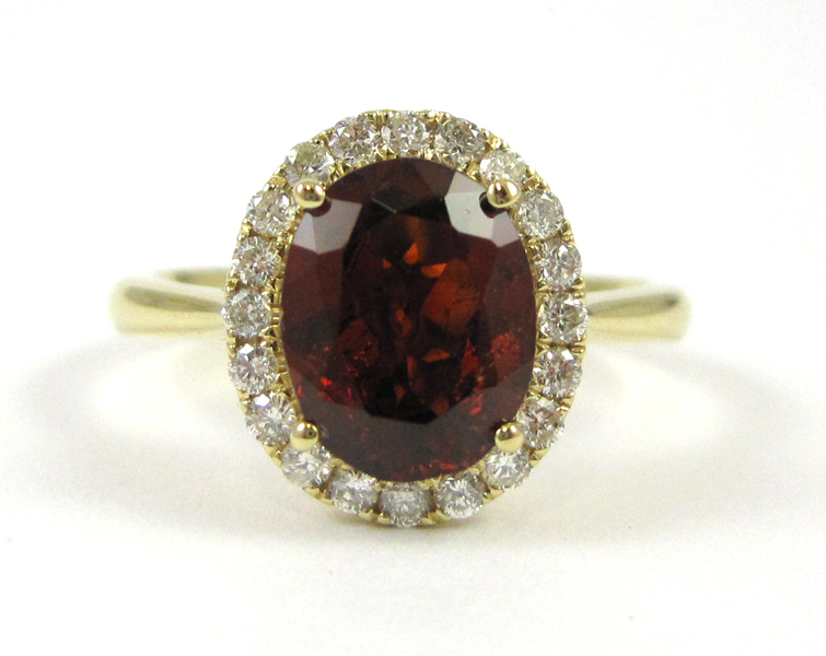 Appraisal: GARNET DIAMOND AND FOURTEEN KARAT GOLD RING with round-cut diamond