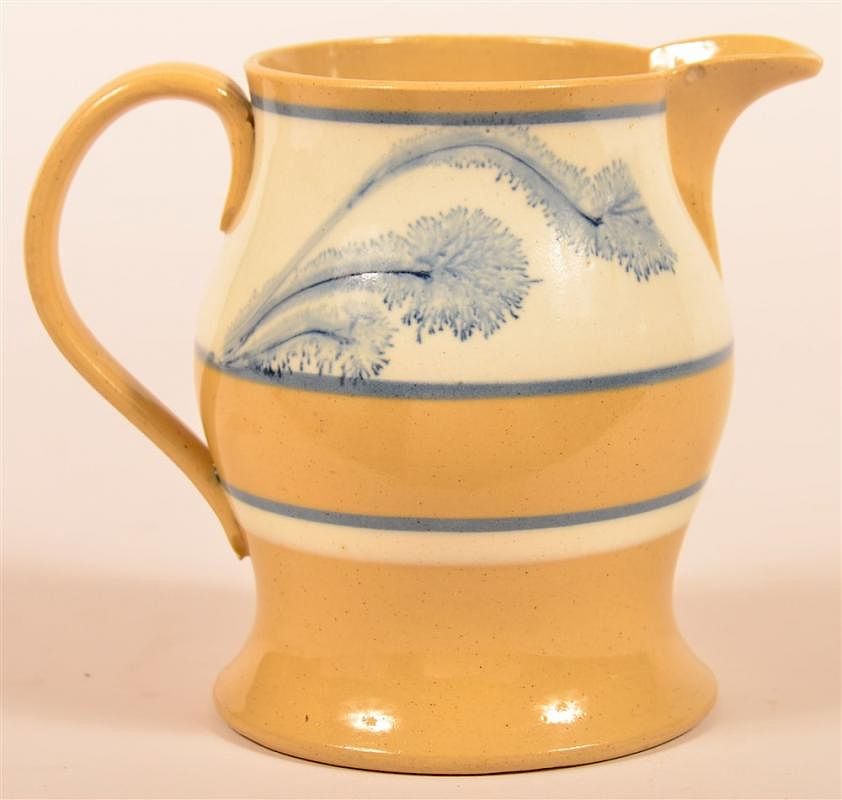 Appraisal: Yellowware Cream Pitcher Seaweed Decoration Yellowware Cream Pitcher with Blue