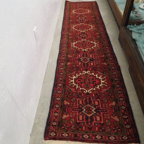 Appraisal: Heriz Persian Handmade Runner geometric medallions deep red field '