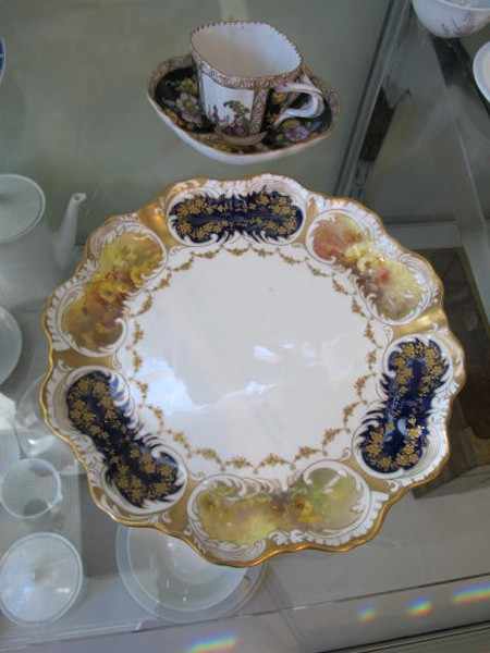 Appraisal: GERMAN PORCELAIN HAND PAINTED CUP AND SAUCER AND A DOULTON