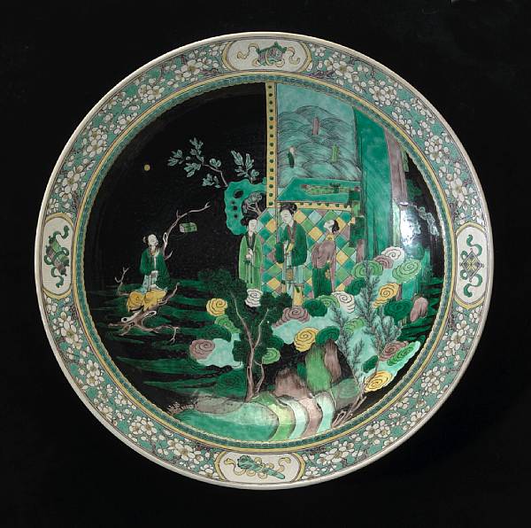 Appraisal: A large famille noire enameled porcelain charger th Century Its