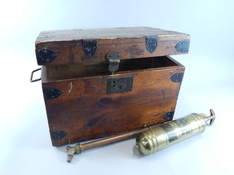 Appraisal: A Victorian pine and ebonised metal small trunk a brass