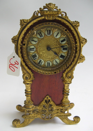 Appraisal: MAHOGANY CASED MANTLE CLOCK spring wound ornately accented with gilt