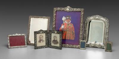 Appraisal: Seven English silver frames rectangular with scroll floral and cupid