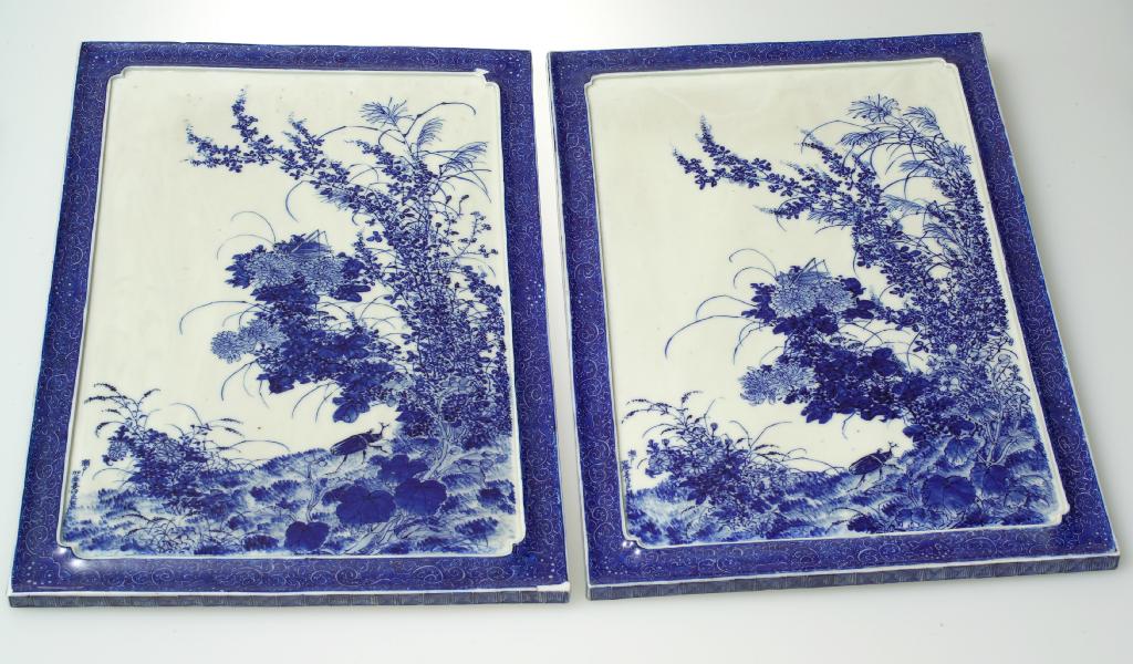 Appraisal: PAIR OF JAPANESE BLUE AND WHITE PORCELAIN PANELS of rectangular