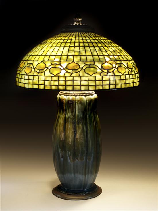 Appraisal: A Tiffany Studios Leaded Glass and Pottery Table Lamp Diameter