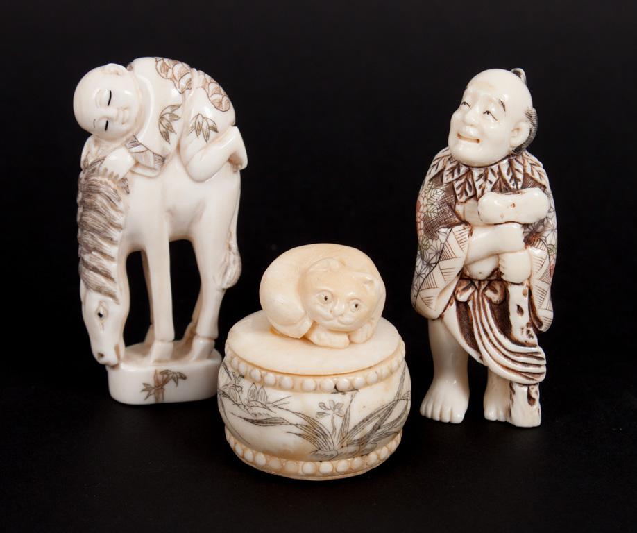 Appraisal: Three oriental ivory objects two Japanese carved polychromed ivory netsukes