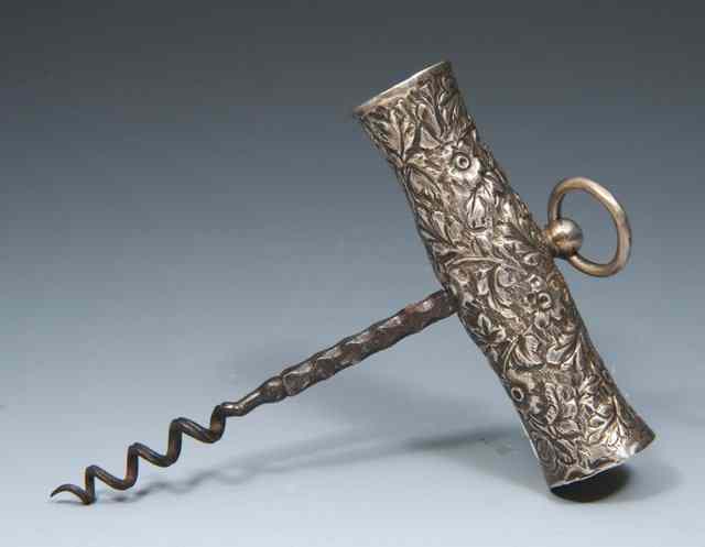 Appraisal: A VICTORIAN CORKSCREW a silver mounted handle with embossed floral