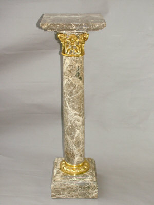 Appraisal: A pair of th century Continental variegated brown marble pedestals