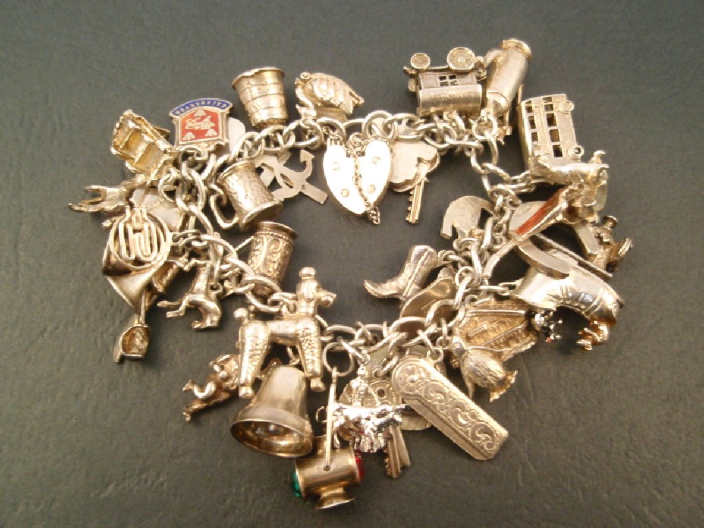 Appraisal: A silver charm bracelet g