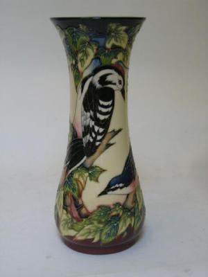 Appraisal: A MOORCROFT POTTERY VASE dated of tall waisted form tube