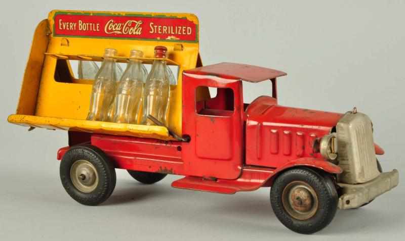 Appraisal: Pressed Steel Metalcraft Coca-Cola Truck Toy Description Includes eight original