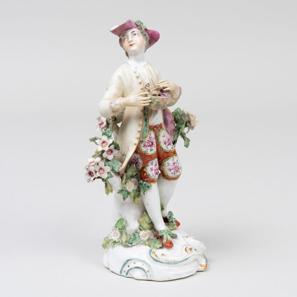 Appraisal: Derby Porcelain Figure of a Shepherd Holding a Bird's Nest