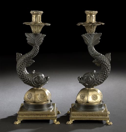 Appraisal: Pair of French Bronze Dolphin Candlesticks in the Restauration style