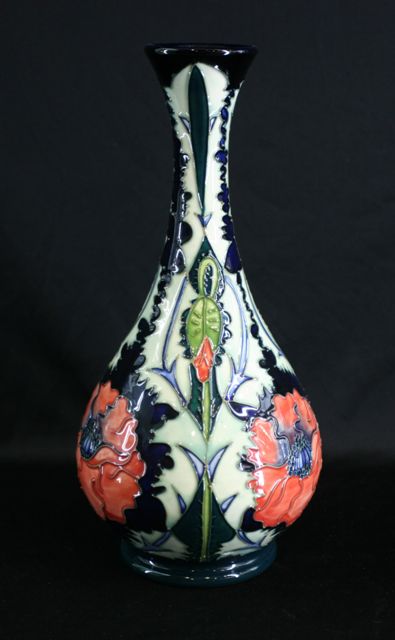 Appraisal: An ovoid vase with tapered cylindrical neck and everted rim