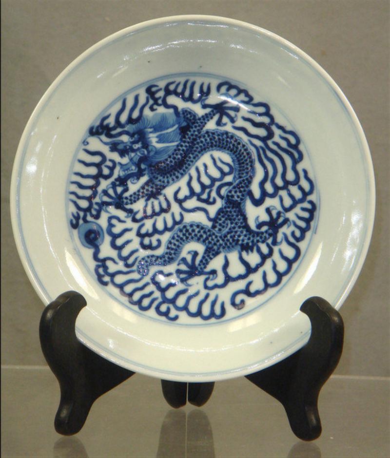 Appraisal: Chinese th th c porcelain plate with dragon design marked