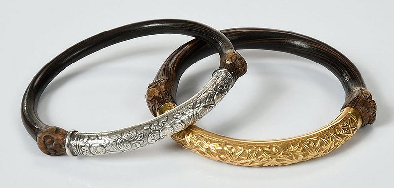 Appraisal: Two Asian Bangles both with carved wood finials one with