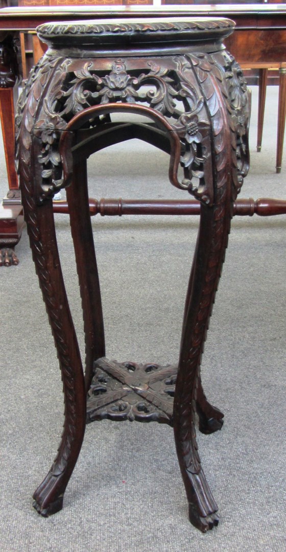 Appraisal: An early th century Chinese carved hardwood jardiniere stand with