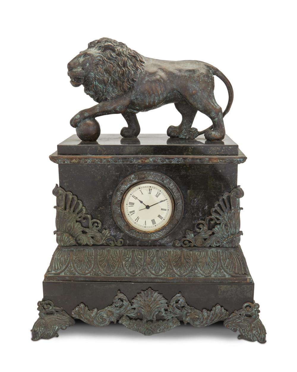 Appraisal: A patinated metal and marble mantel clock Fourth-quarter th Century