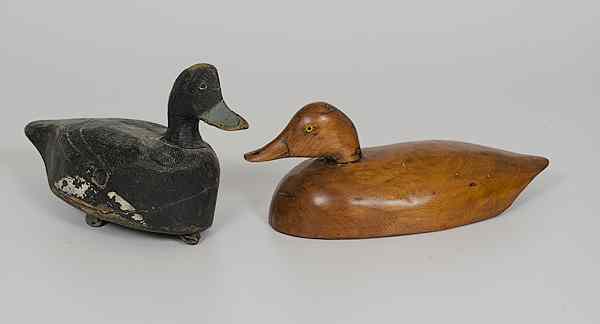 Appraisal: Carved Wood Decoys Two carved wood decoys one carved and