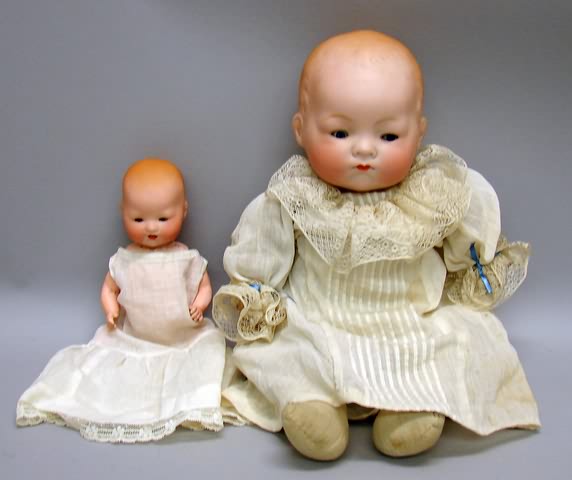 Appraisal: Pair of solid dome baby dolls T cir A M