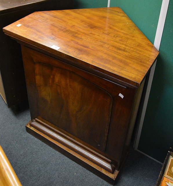 Appraisal: A th Century mahogany standing corner cupboardthe door enclosing a