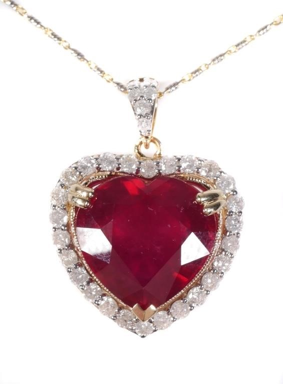 Appraisal: Natural heart-cut ruby about carats surrounded by diamonds weighing about