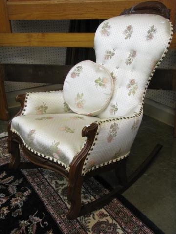 Appraisal: Victorian upholstered rocking chair carved walnut frame silk upholstery with