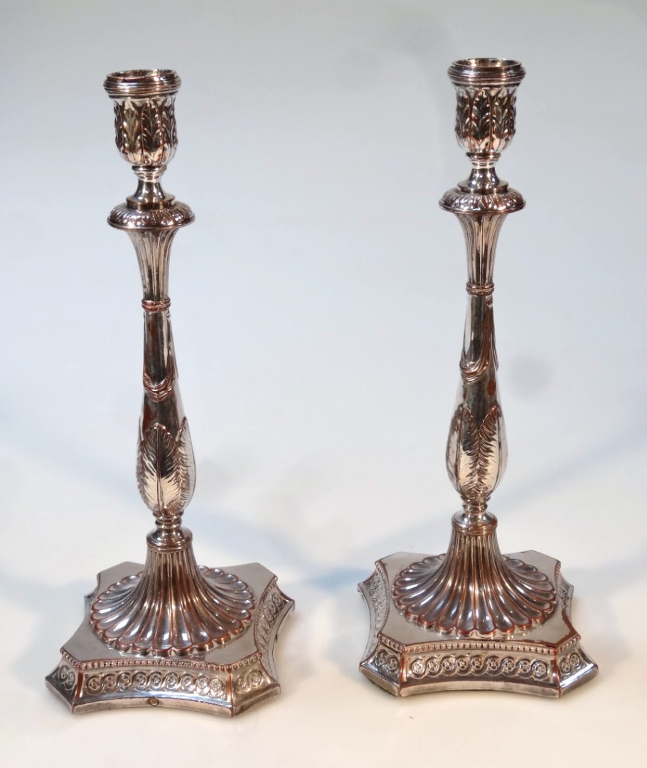 Appraisal: A pair of thC Old Sheffield plate candlesticks each of