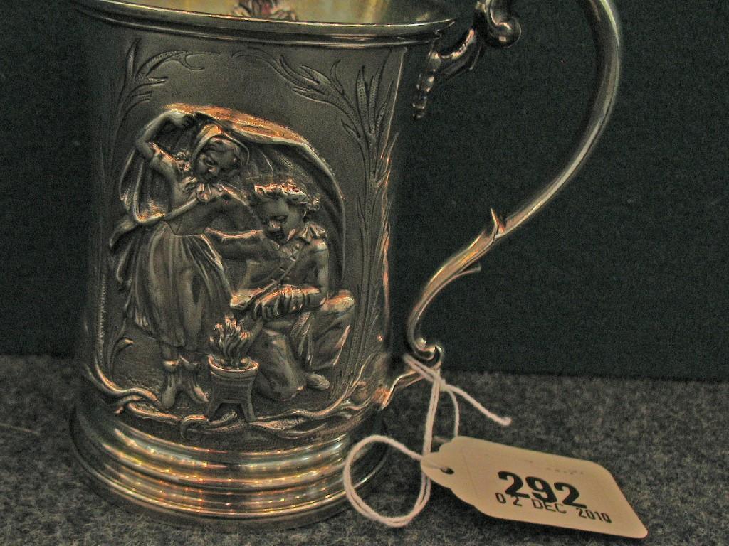 Appraisal: A VICTORIAN SILVER MUG decorated with children