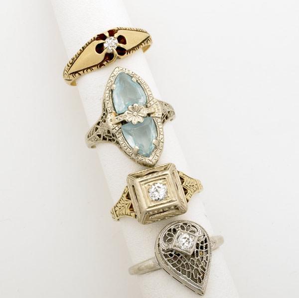 Appraisal: FOUR ART DECO FILIGREE RINGS k wg with two aquamarines