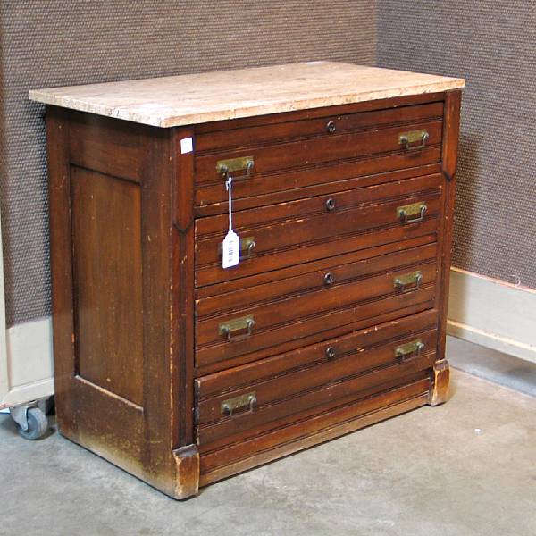 Appraisal: A campaign style walnut chest of drawers early th century