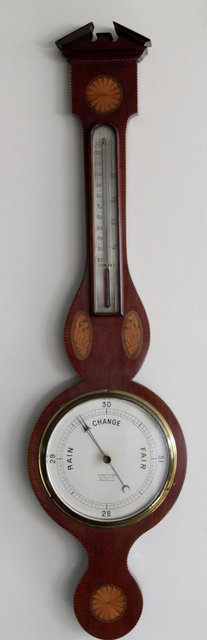 Appraisal: An Edwardian inlaid cased barometer the silvered dial signed George