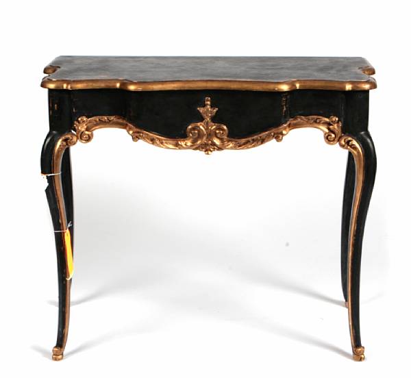 Appraisal: A Rococo style parcel gilt ebonized console table height in