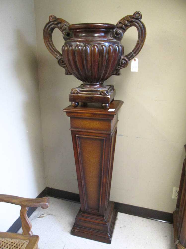 Appraisal: TWO-HANDLE URN ON FLOOR PEDESTAL a large cast ceramic urn