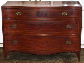 Appraisal: George III The solid mahogany serpentine form with three graduated