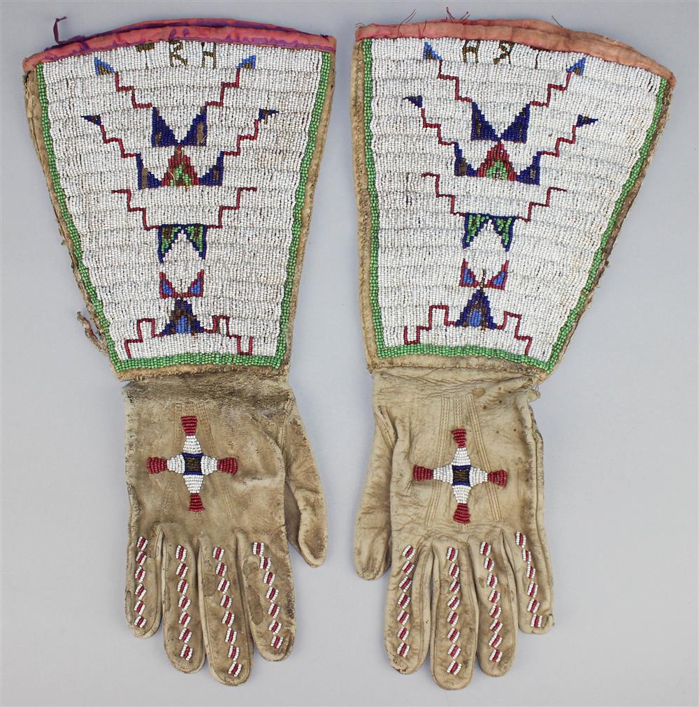 Appraisal: PAIR OF PLAINS BEADED HIDE GAUNTLETS SIOUX initials TRH beaded