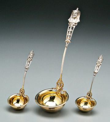 Appraisal: Three coin silver ladles one with Egyptian head handle -