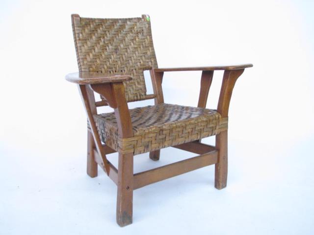 Appraisal: A lodge style paddle arm chair circa mid th century