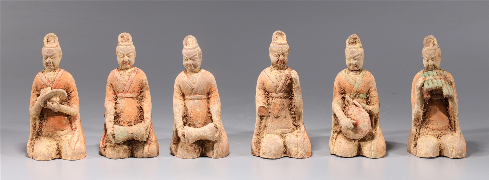 Appraisal: Group of six early style Chinese ceramic musicians in orange