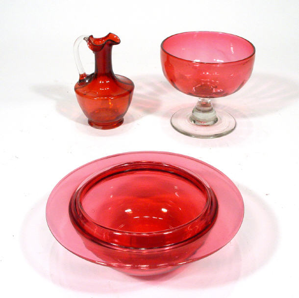 Appraisal: Victorian Cranberry glass sundae dish a Cranberry glass muffin dish