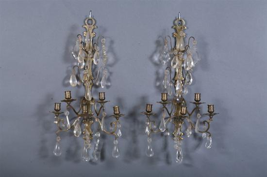 Appraisal: PAIR LOUIS XV-STYLE BRASS FIVE-LIGHT SCONCES th century Shaped brass