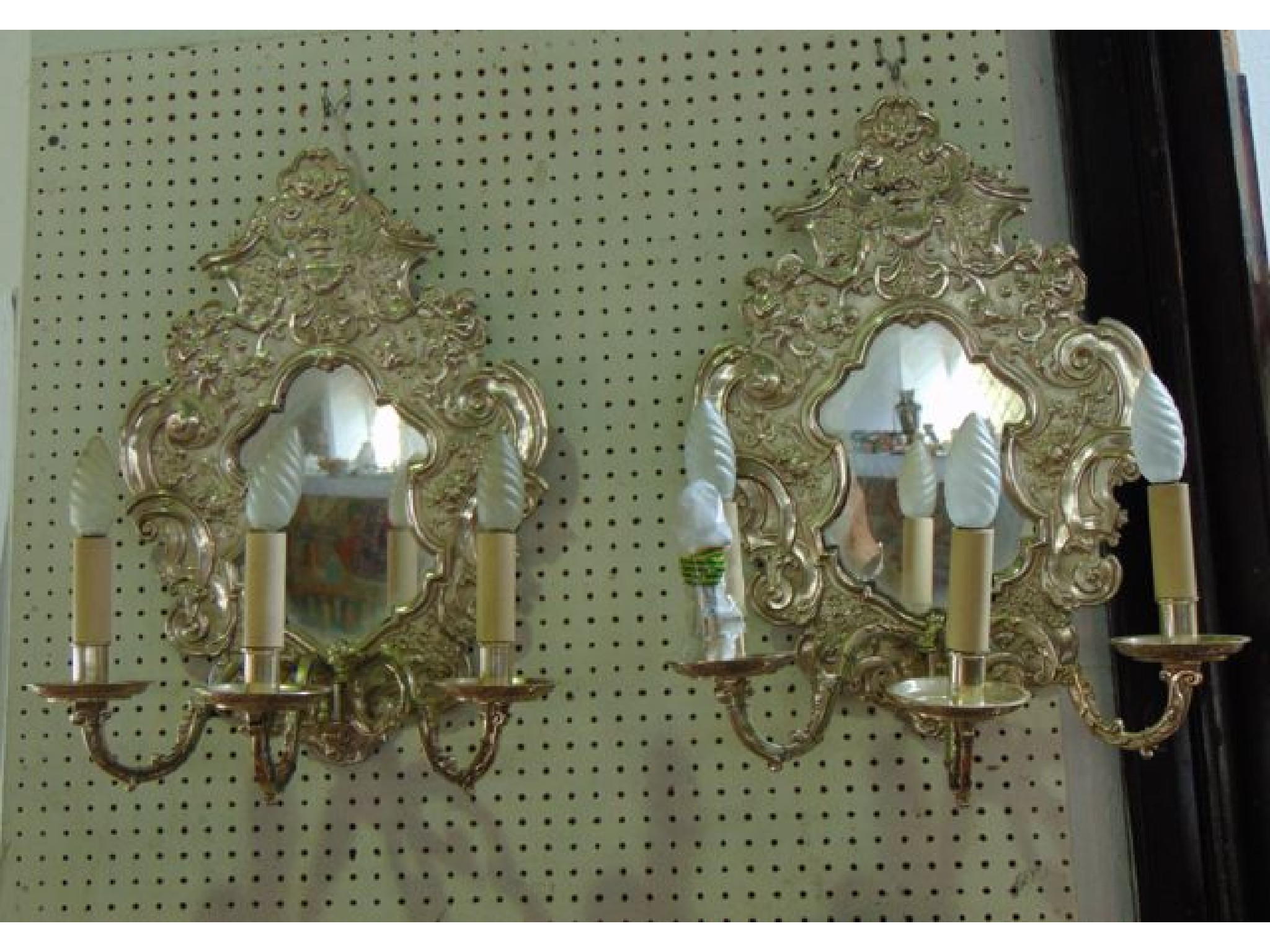 Appraisal: A pair of chromium plated three divisional wall sconces converted